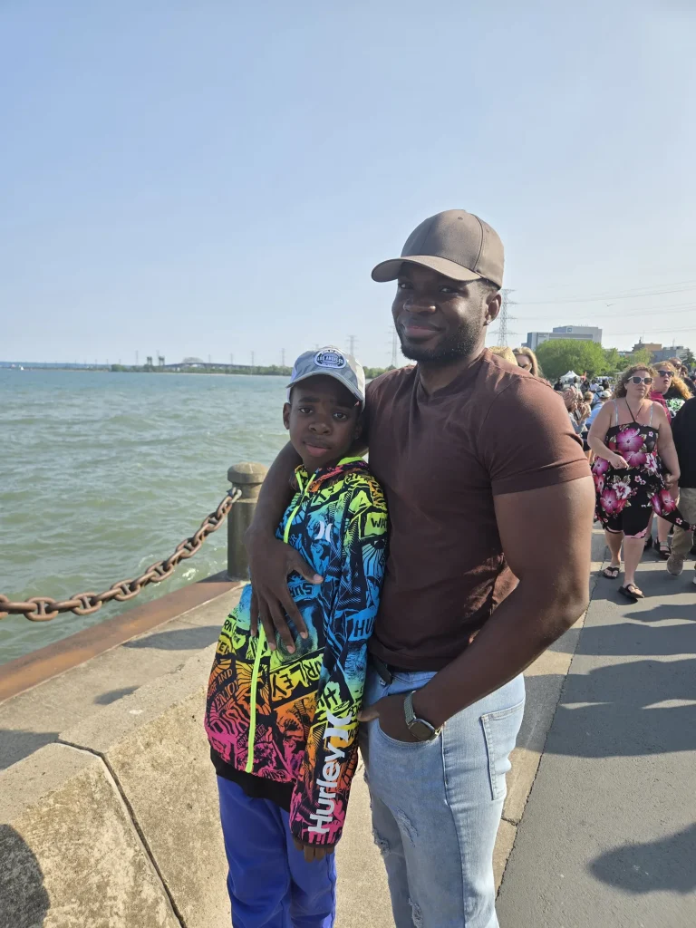 Phil and his son Sage together by the water